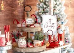 three tiered tray with christmas decorations on it