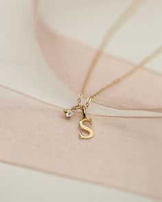 Baby Diamond Solitaire Necklace with Initial CharmCute twist on a classic diamond solitaire necklace• Material: Available in 14K Yellow Gold • Genuine Diamond: 0.03ct. VS Clarity F-H color• For bigger diamond size please message us we can customize for you 14k Gold Initial Pendant Necklace With Single Diamond, 14k Gold Initial Necklace With Single Diamond, Everyday Yellow Gold Initial Necklace With Diamond, Gold Solitaire Necklace In Sterling Silver, Yellow Gold Initial Pendant Charm Necklace With Diamond Accents, Yellow Gold Charm Necklace With Diamond Initial Pendant, Dainty Diamond Initial Pendant Necklace, Anniversary Single Diamond Initial Pendant Necklace, Yellow Gold Charm Necklace With Diamond Accents