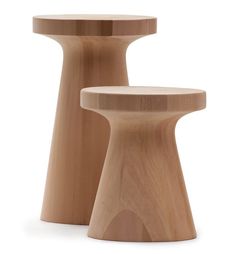 two wooden stools sitting next to each other