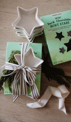 three star shaped dishes tied with ribbon and sitting next to each other on a table