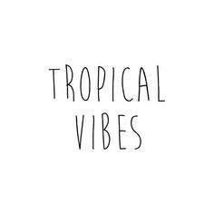 the words tropical vibes written in black ink