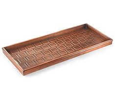 a wooden tray with an intricate design on it