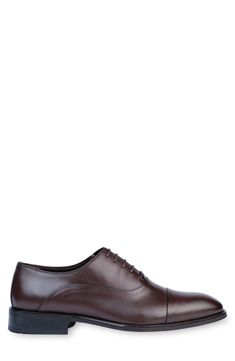 Handmade of smooth leather, this cap-toe dress shoe with a classic oxford silhouette offers a sophisticated, elegant look. Leather upper and lining/synthetic sole Made in Turkey Classic Oxford Lace-up Shoes With Rubber Heel Cap, Classic Cap Toe Business Lace-up Shoes, Cap Toe Oxford Lace-up Shoes For Business, Classic Cap Toe Dress Shoes For Business Casual, Classic Oxford Lace-up Cap Toe Shoes, Classic Cap Toe Lace-up Oxford Shoes, Business Derby Oxford Shoes With Cap Toe, Classic Oxford Lace-up Shoes For Business, Business Casual Cap Toe Derby