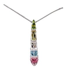 Captivating Genuine Gem set Comet Pendant, beautifully arranged and set with: a Peridot, weighing approx. 3.21ct; a Topaz, weighing approx. 4.65ct; a Rose de France, weighing approx. 6.7ct; a Blue Topaz, weighing approx. 4.88ct and a Pink Tourmaline, weighing approx. 5.02 ct, accented by nineteen diamonds, weighing approx. 0.19ct; hand crafted in 14k white gold; Simply beautiful...taking you from day to evening with elegant ease! Pendant Necklace Diamond, Coach House, Solitaire Pendant Necklace, Necklace Diamond, Stylish Necklace, Statement Pendant, Solitaire Pendant, Diamond Gold, Fine Jewelry Collection