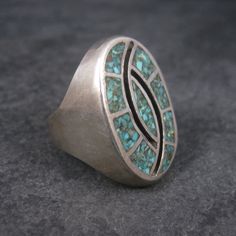 This beautiful 1970s southwestern ring is sterling silver. It features turquoise chip inlay. The face of this ring measures 1 3/16 inches north to south. Weight: 23.3 grams Size: 9.5 Marks: None - acid tested Condition: Excellent Southwestern Polished Turquoise Ring Collectible, Vintage Sterling Silver Turquoise Ring With Inlay, Inlay Jewelry, Teardrop Ring, Beaded Skull, Coral Turquoise, Pearl Stud Earrings, Pearl Studs, Vintage Rings