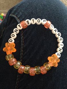 "DONT STOP DANCING" yellow/orange kandi single (copied from Pinterest) Yellow Kandi Bracelets, Rave Bracelets Ideas, Kandi Singles