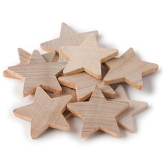 several wooden stars are arranged on a white surface