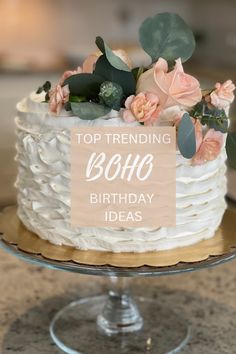 a white cake sitting on top of a table with a sign that says, top trending 80th birthday ideas