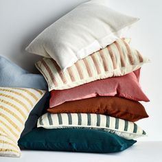 several pillows stacked on top of each other