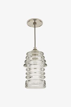 a clear glass light fixture hanging from a ceiling