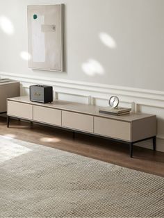 a living room scene with focus on the coffee table and sideboard in the foreground