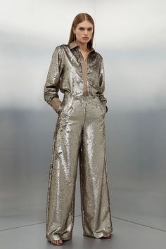 The ultimate party piece, these sequinned trousers are cut in a relaxed wide leg style to exude after-dark decadence. Make an instant statement and style this standout piece with the matching shirt and barely-there heels.TrousersSequinsHigh waistedWide leg Shiny Trousers Outfit, Sparkle Pants, Plus Size Workwear, Nye Outfits, New Years Eve Dresses, Eve Dresses, New Years Eve Outfits, Karen Millen, Petite Dresses