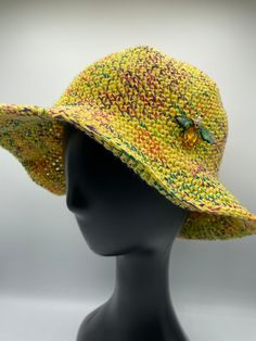 Stylish 100% cotton crocheted bucket hat.  Fits size 21-22 inches circumference.  Comes with a bee pin down on it.  Handwashing is recommended.  Lay flat to dry. Yellow Knitted Crochet Hat For Spring, Casual Yellow Crochet Hat With Short Brim, Casual Yellow Crochet Hat With Wide Brim, Casual Yellow Crochet Hat Hand Knitted, Casual Yellow Crochet Hat, Casual Yellow Handmade Crochet Hat, Casual Yellow Wide Brim Crochet Hat, Casual Yellow Crochet Sun Hat, Casual Yellow Crochet Bucket Hat