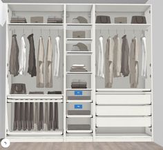 a white closet with drawers and clothes hanging on the wall, next to a wooden floor