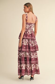 The Kyra Maxi Dress in a wine hue is your ticket to summer elegance! With its floral print, sleeveless ruched bust, and tiered design, this dress is ready to turn heads. It’s perfect for making a statement while sipping cocktails or dancing the night away. Color: Wine Self: 100% Polyester, Lining: 80% Polyester, 20% Rayon Hand wash cold, dry flat. Item #MD4733A Size/Fit Model is wearing size S. Summer Elegance, Instagram Blog, Collar Shirts, New Shop, Dancing, Fitness Models, Floral Print, Floral Prints, Hand Wash