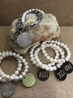 The three bracelets have been my SHOW SPECIALS this Fall at my holiday shows around the Southeast US. They are stretchy freshwater pearl bracelets that feature one of the three discs...silver, gold or antique brass. Engraved with your initials...just choose your finish and font! Wonderful bridesmaid gifts and also great for Sorority Lil Sis/Big Sis gifts. White Monogram Jewelry For Wedding, White Monogrammed Jewelry For Wedding, White Monogram Wedding Jewelry, Elegant Charm Bracelet With Engraving Option, Silver Initials Bracelet For Wedding, Silver Initials Bracelets For Wedding, Personalized Elegant Silver Beaded Bracelets, Elegant Engraved Beaded Bracelets As Gift, Elegant Monogram Stainless Steel Jewelry