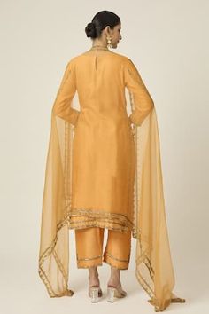 Amber yellow kurta with floral sequin, cutdana and bead embroidery. Paired with an embroidered pant and dupatta with embroidered border. - Aza Fashions Fitted Palazzo Set With Gota Work And Straight Kurta, Fitted Chanderi Palazzo Set With Gota Work, Fitted Embroidered Tissue Silk Palazzo Set, Fitted Chanderi Palazzo Set For Festive Occasions, Fitted Organza Kurta With Mirror Work, Fitted Raw Silk Palazzo Set For Festive Occasions, Fitted Tissue Silk Palazzo Set With Gota Work, Designer Unstitched Suit With Gota Work, Fitted Raw Silk Palazzo Set With Gota Work