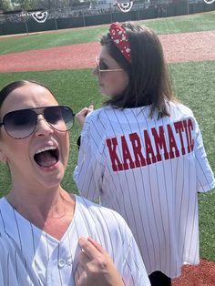 Stand out at the game with our Custom Pinstripe Baseball Jersey. This jersey features intricate embroidery and glitter applique, making it truly one-of-a-kind. Show off your unique style and personality with this playful and fun addition to your baseball gear. (And impress your teams, too!) Pricing includes one name on the back and one number, additional customization can be added, please ask for details on pricing! PLEASE NOTE the name and number, as well as glitter color in the notes! Product White Varsity Baseball Jersey For Game Day, Varsity White Baseball Jersey For Game Day, Casual Team-colored Baseball Jersey With Three Stripes, Casual Three Stripes Baseball Jersey, Striped Varsity Baseball Jersey For College, College Baseball Jersey With Three Stripes, College Sports Fan Baseball Jersey For Baseball Season, Cotton College Baseball Jersey With Three Stripes, Varsity Cotton Baseball Jersey For Fan Gear