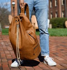 Reclaimed Surplus Duffel in Heirloom Oak by Moore & Giles Casual Weekender Bag With Waxed Finish For Travel, Casual Weekender Bag With Waxed Finish, Casual Waxed Finish Weekender Bag For Travel, Practical Brown Duffle Bag For Everyday Use, Practical Brown Everyday Duffle Bag, Casual Duffle Bag With Luggage Sleeve, Casual Waxed Finish Weekender Bag, Casual Waxed Weekender Bag For Everyday, Casual School Duffle Bag With Luggage Sleeve