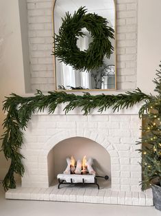 a white brick fireplace with a wreath on top