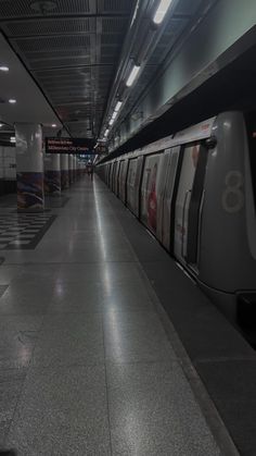 an empty subway station with no people on the platform