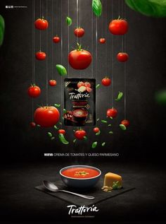 an advertisement with tomatoes hanging from strings and cheese on the side, in front of a black background