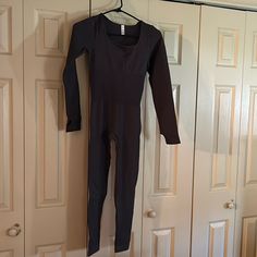 One Piece Long Sleeve Elastic Jumpsuit. No Tags! Never Worn! Fitted One-piece Bodysuit For Loungewear, Black Fitted Onesie For Loungewear, Fitted Solid Color Onesie For Loungewear, Fitted Long Sleeve Solid Onesie, Stretch Bodysuit Overall For Loungewear, Stretch Loungewear Bodysuit Overall, Fitted Full-length Bodysuit For Loungewear, Fitted Full Length Bodysuit For Loungewear, Shein Pants