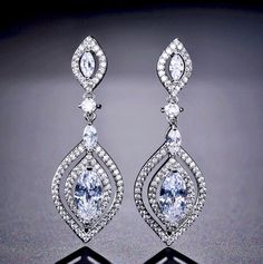 Wedding Jewelry - Silver Cubic Zirconia Bridal Earrings Formal Marquise Bridal Earrings With Diamond Accents, White Crystal Earrings With Diamond Accents, Elegant Chandelier Earrings With Diamond Cut Cubic Zirconia, Elegant Diamond Cut Cubic Zirconia Chandelier Earrings, Elegant Cubic Zirconia Chandelier Earrings With Diamond Cut, Glamorous White Cubic Zirconia Chandelier Earrings, Dazzling Sparkling Diamond Earrings For Formal Occasions, White Crystal Diamond-cut Earrings, Marquise Cubic Zirconia Diamond Earrings For Formal Events