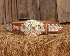 Unique handcrafted western leather belt with horse shoe design stitching and belt buckle Western Concho Belts For Ranch, Western Hand Tooled Belt Buckles For Rodeo, Western Antique Belt Buckle For Rodeo, Southwestern Antique Belt Buckle For Rodeo, Southwestern Antique Belt Buckles For Ranch, Embroidered Leather Belt For Western-themed Events, Leather Embroidered Belt For Western-themed Events, Western Belts And Suspenders For Ranch, Leather Belt With Embroidery For Western-themed Events