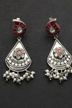 92.5 Silver toned drop pattern dangler earrings studded with pink kundan kairi motifs and pearl tassels. - Aza Fashions Silver Teardrop Pearl Drop Danglers, Traditional Teardrop Pearl Drop Danglers, Silver Teardrop Danglers With Pearl Drop, Traditional Silver Drop Jewelry, Traditional Teardrop Sterling Silver Danglers, Silver Pearl Drop Danglers For Diwali, Traditional Silver Drop Earrings, Diwali Silver Pearl Drop Danglers, Traditional Sterling Silver Drop Jewelry