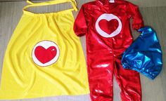 two children's costumes are laying on the floor, one is yellow and the other is red