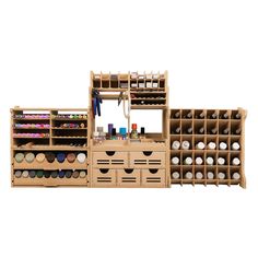 a wooden storage unit filled with lots of crafting supplies