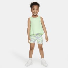 This 2-piece set is sure to make your little athlete stand out on the playground! The tank top features modern pleated detailing that creates an elevated look while adding breezy movement. The Swooshtastic bike shorts have a stretch waistband for a nice fit and both pieces are enhanced with quick-drying, moisture-wicking Dri-FIT technology to help little ones stay comfy and keep the pep in their step. Playful Stretch Tank Top For Spring, Green Sleeveless Activewear For Summer, Nike Summer Athleisure Activewear, Nike Athleisure Activewear For Summer, Nike Green Go-dry Tops, Sporty Summer Tops For Playwear, Green Sleeveless Activewear With Go-dry, Green Sleeveless Go-dry Activewear, Spring Stretch Activewear For Play