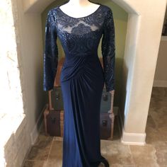 Incredible Navy Blue Formal Gown. Lace And Sequin Overlay And Bodice, Back And Sleeves. Flattering Pleats At Waistline. Full Back Zip. Blue Long Sleeve Lace Gown, Blue Lace Evening Dress With Long Sleeves, Blue Lace Long Sleeve Evening Dress, Blue Long Sleeve Lace Evening Dress, Blue Lace Embellished Gown, Royal Blue Long Sleeve Evening Dress For Formal Occasions, Blue Lace Long Sleeve Mother Of The Bride Dress, Fitted Blue Lace Mother Of The Bride Dress, Blue Lace Fitted Mother Of The Bride Dress