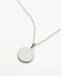 Engravable Round Necklace | Sterling Silver. Make It Personal with a Necklace. Paired with a Delicate Chain, the Smooth Clip-On Pendant Can be Engraved on Both Sides – the Perfect Gift for that Special Someone. Opt for the Engravable Round Disc Pendant. Please Note: Engraving Items May Take 7-10 Working Days to Process. Pendant Metal: Sterling Silver Pendant Dimensions: 15mm Short Plain Chain: Total Length 450mm with Extension Links at 410mm, 430mm and 450mm Weight: 4. 3 Gproduct Code: En-S-N1-N