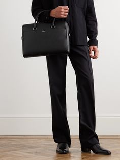 SAINT LAURENT's briefcase is a refined classic that's been perfected over the decades. Crafted from black full-grain leather, it has a structured silhouette that's smart and sleek. Use it to elevate your workwear repertoire. Formal Briefcase With Palladium Hardware, Classic Saffiano Leather Bags For Formal Occasions, Palladium Hardware Briefcase For Work, Elegant Saffiano Leather Briefcase For Formal Use, Elegant Textured Leather Briefcase For Workwear, Elegant Formal Saffiano Leather Briefcase, Elegant Formal Briefcase In Saffiano Leather, Timeless Black Briefcase With Leather Lining, Elegant Textured Leather Briefcase For Work