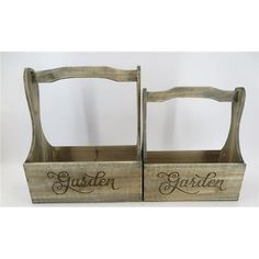 two wooden baskets with the word garden on them