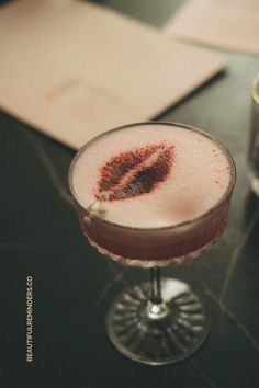 a close up of a drink in a glass on a table