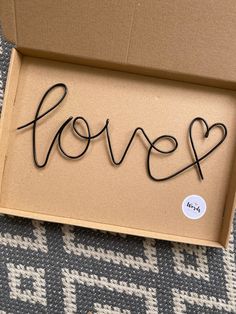 a cardboard box with the word love written in it