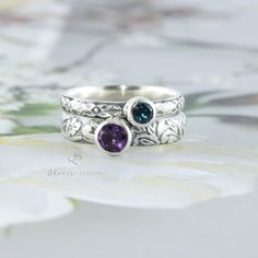 This custom made ring set is made with 2 separate solid sterling silver bands. This listing includes one 4mm gemstones and one 5mm gemstone. The gemstones are set in sterling silver tube bezels. You may choose the bands you love, let me know if you have any questions. Finish: You can choose a classic finish or an oxidized/darkened finish. Gemstones included are listed below. Gems are natural unless otherwise indicated. The last picture shows the gems included in this listing. Some photos shown i Sterling Silver Stackable Rings For Anniversary - May Birthstone, Silver Stackable Promise Rings With May Birthstone, Sterling Silver Stackable Rings For Anniversary, May Birthstone, Adjustable Stackable Sterling Silver Birthstone Ring, Silver Stackable Rings With May Birthstone, Silver Stackable Rings For May Birthstone, Adjustable Sterling Silver Stackable Rings, May Birthstone, Adjustable Sterling Silver Stackable Rings For May Birthstone, Handmade Sterling Silver Birthstone Ring For Anniversary