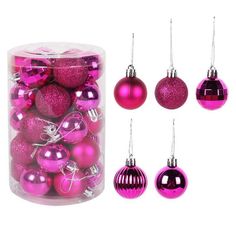 pink christmas ornaments are in a clear container