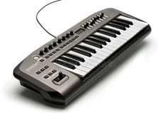 an electronic keyboard on a white background with headphones royalty images and clippings