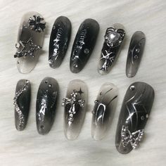 These are handmade press on's created by me!  What's included?  - 10 nails  - nail glue - file - cuticle pusher - instructions Nail Shape in the photo: Long Round How to figure out your nail sizes? Watch this quick tutorial: https://youtu.be/qLeTBvGe_hI Nails are made to order so you can pick any length, size, and shape. Please know that order processing time is 5-7 business days because the nails need to be made and personalized to your preference.  They can last 1-3 weeks depending on how well Y2k New Jeans, Ongles Goth, Nails With Silver, Punk Nails, Korean Nails, Goth Nails, Grunge Nails, Pretty Gel Nails, Really Cute Nails