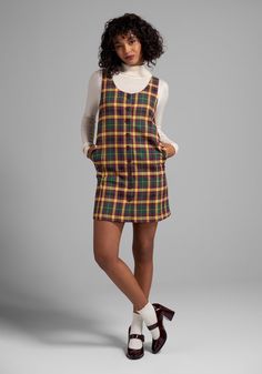 In an exclusive plaid print made up of rich and earthy tones of mustard, hunter green, and burgundy, you can’t get more retro than this fully-lined shift dress from our ModCloth namesake label ! Made from a stretchy woven fabric, this sleeveless shift dress boasts front button-up closure, a curved V-neckline and a fabulous flared hemline at the knee-length skirt. The classic relaxed silhouette is perfect from adding warm layers in the colder months, and this easy A-line looks fresh and playful w Late 60s Womens Fashion, 90s Fall Outfits Plus Size, Mod Dress Outfit, 80s Dress Outfit, Modern 60s Outfits, Chubby Alternative Fashion, 90s Womens Fashion, Toast Fashion, 80s Fashion Black Women