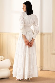 FINAL SALE! NO RETURNS. NO EXCHANGES. Georgia Maxi Dress will make a lasting impression at your next spring event! With an elastic waist, long sleeves, and tiered peasant skirt. LENGTH: 52" from top of shoulder FABRICATION: 100% White Linen STYLE#;DR-21450 White Linen - WHITE-S24 *Dry Clean or wash on cold and hang flat to dry *Model is wearing size XS Temple Dresses For Women, White Dress Modest, Modest Winter Dresses, Graduation White Dress, White Peasant Dress, Classy White Dress, Celtic Dress, White Dress Winter, White Flowy Dress