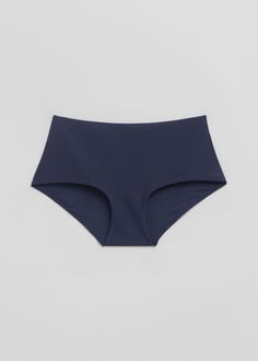 High waist bikini bottoms with a textured finish and full coverage.Fully lined Seamless Beachwear Bottoms For Poolside, Blue Seamless Nylon Tankini, Blue Nylon Seamless Swimwear, Seamless Shaping Swimwear, Blue Nylon Swimwear With Seamless Construction, Shaping Seamless Swimwear For Swimming, Blue Elastane Brief Swimwear, Seamless Nylon Beach Bottoms, Blue Seamless Micro-elastic Swimwear