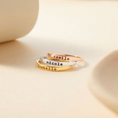 These stacking name rings are great ways to wear children's names. A great gift for any occasion  ► DAINTY STACKING NAME RING * Character limits: 10 characters. * By default, silver items comes with BLACK engraving and gold-plated item comes with CLEAR engraving * All of our jewelry are handmade from scratch and packaged with care in our workshop ► HOW TO ORDER & ADD PERSONALIZATION - Select your preferred color and size ring from the menu. - Include in the "Add your personalization" box the pet Custom Name Engraved Adjustable Ring For Mother's Day, Adjustable Engraved Ring With Custom Name For Mother's Day, Nameplate Rings Suitable For Gifts, Personalized Adjustable Rings For Mother's Day, Nameplate Ring As Gift, Personalized Adjustable Engraved Ring For Mother's Day, Adjustable Rings With Names For Mother's Day, Adjustable Personalized Engraved Ring For Mother's Day, Personalized Name Rings For Birthday