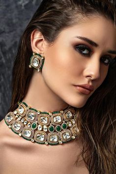 22kt gold plated choker with hydro polkis, kundan, green agate beads embellishment. Comes with earrings.
Components: 1 Necklace, Pair of earrings
Type: Polki, Kundan, Agate Bead
Composition: Brass
Color: Green
Other Details: 
Dimensions L x W x H (in cms): 
Necklace: 38 x 6 x 1
Earrings: 3 x 3 x 1
Weight (in gms):
Necklace: 151
Earrings: 22
Set: 173
Closure:
Necklace: Pull out drawcord
Earrings: Push back clasp - Aza Fashions Bridal Choker Set, Brass Choker, Emerald Diamond Necklace, Bridal Jewellery Online, Bridal Choker, Diamond Necklace Set, Choker Set, Bridal Jewellery Indian, Macrame Necklace