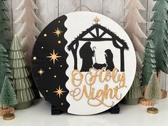 a wooden sign that says merry night with a nativity scene