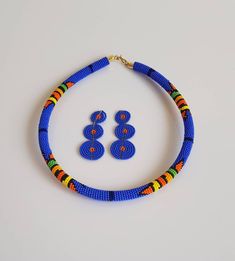 100% handmade using fine beads. Details: *Necklace comes with matching earrings. *Necklace length: 18 inches around the neck. Earrings -3 inches long. *Ships via Dhl express. **Buy multiple items and pay shipping for one item Only. More neckleces here; https://www.etsy.com/shop/TribalTess?ref=seller-platform-mcnav&section_id=21306083 Back to my shop; https://www.etsy.com/shop/TribalTess?ref=seller-platform-mcnav Blue Round Beaded Necklaces With Colorful Beads, Blue Beaded Necklaces With Colorful Beads, Blue Beaded Earrings With Polished Beads As Gift, Blue Beaded Earrings As Gift, Blue Polished Beaded Earrings For Gifts, Traditional Blue Multi-strand Beaded Necklaces, Orange Multi-strand Beaded Necklaces, Blue Multi-strand Beaded Necklaces For Gifts, Cheap Orange Multi-strand Necklaces